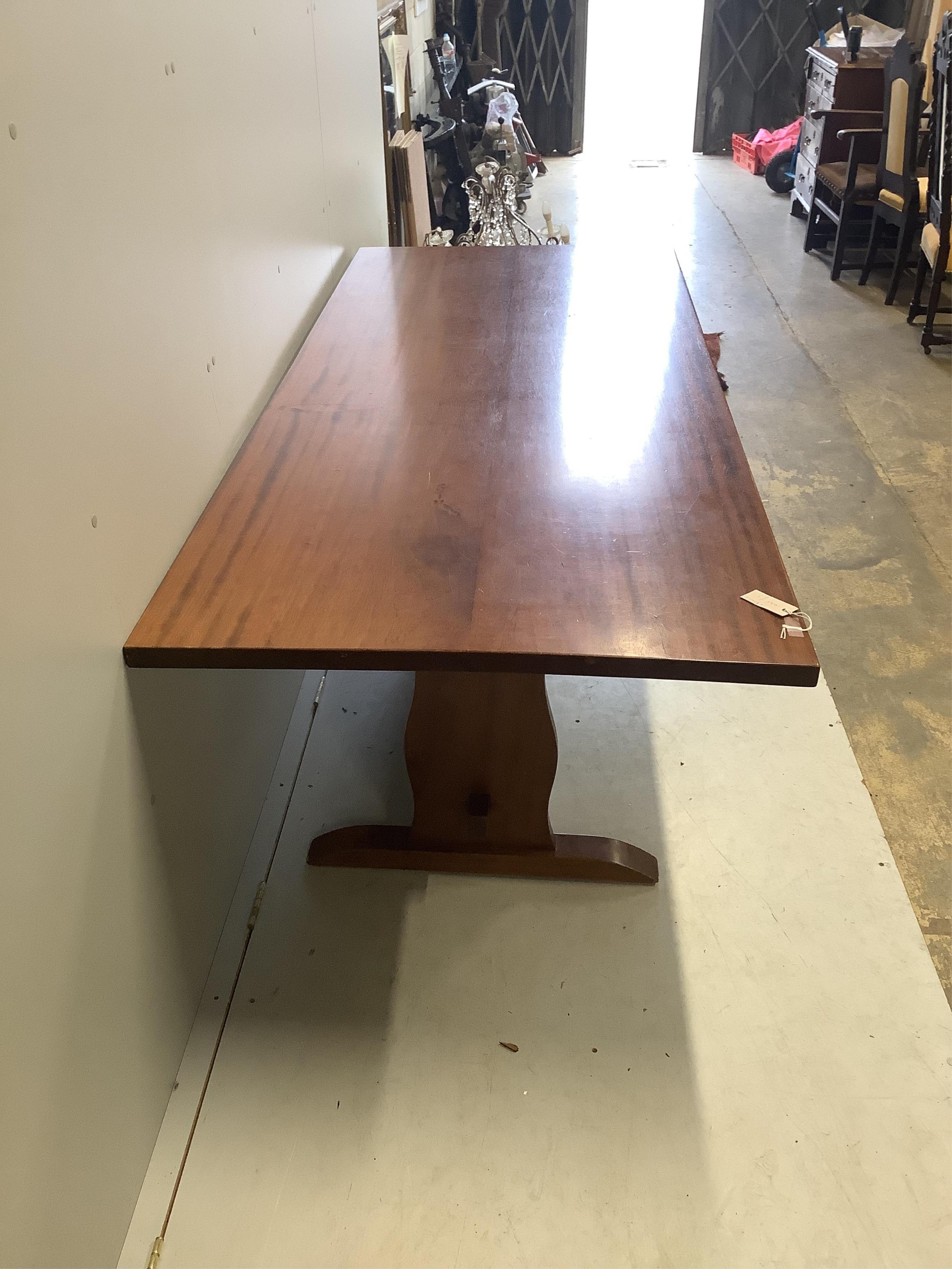 A rectangular hardwood refectory dining table, width 214cm, depth 89cm, height 71cm, together with eight early 20th century oak dining chairs. Condition - fair to good